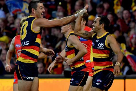 Port Adelaide defeats Adelaide Crows by four points in Showdown 50.